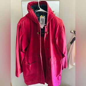 Red hoodie coat a little longer that the usual coats.